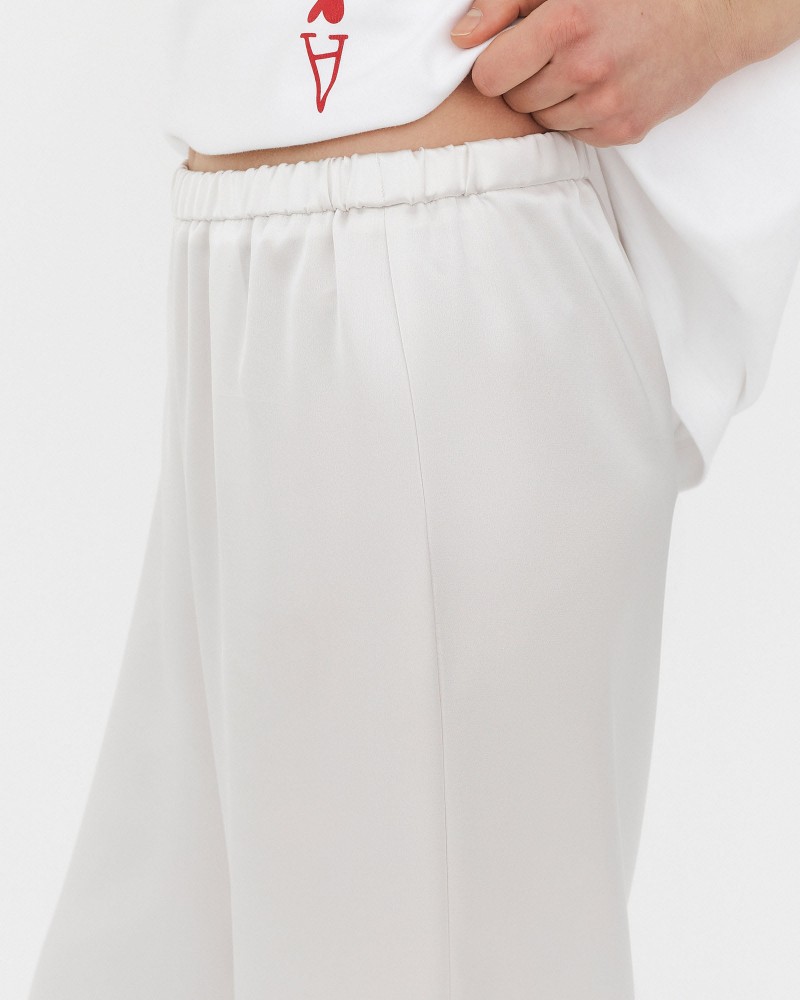 Штани сатинові з еластичним поясом від FASHIONISTA молочний Штани сатинові з еластичним поясом від FASHIONISTA молочний