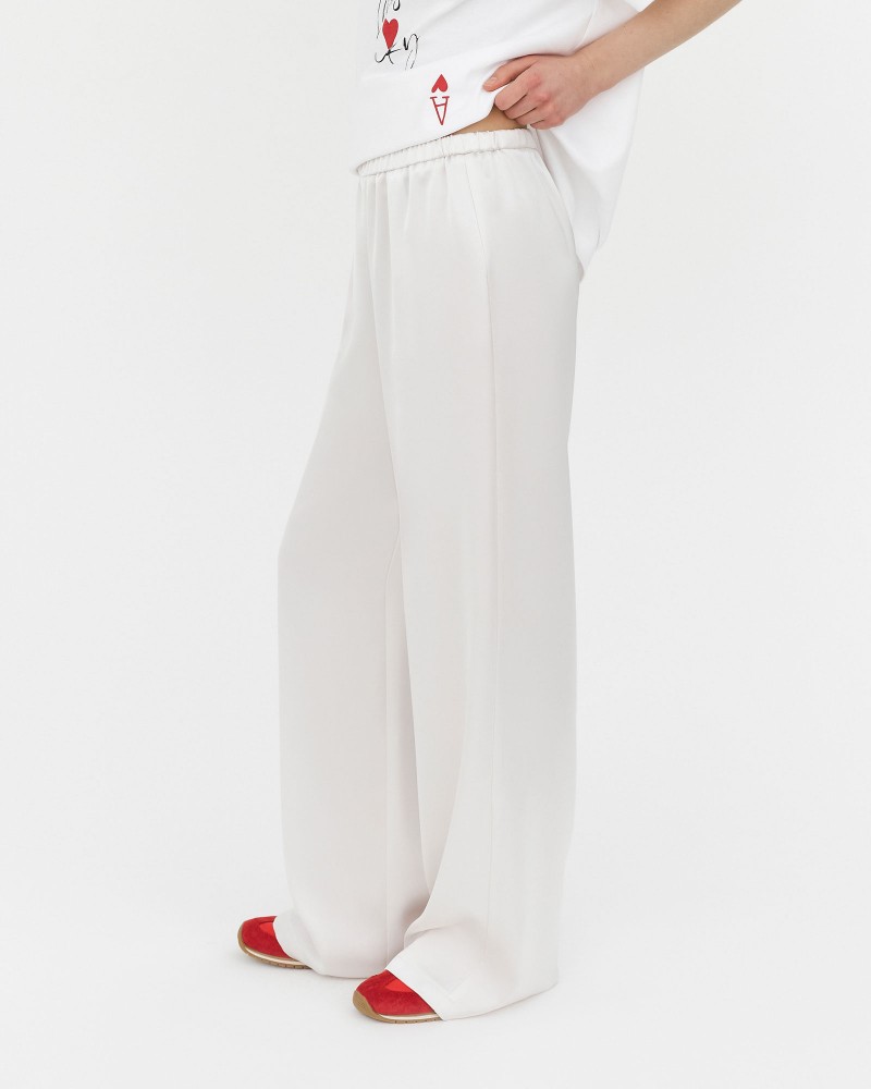 Штани сатинові з еластичним поясом від FASHIONISTA молочний Штани сатинові з еластичним поясом від FASHIONISTA молочний