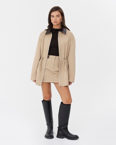 Бежева мініспідниця з вставками зі штучної шкіри FASHIONISTA