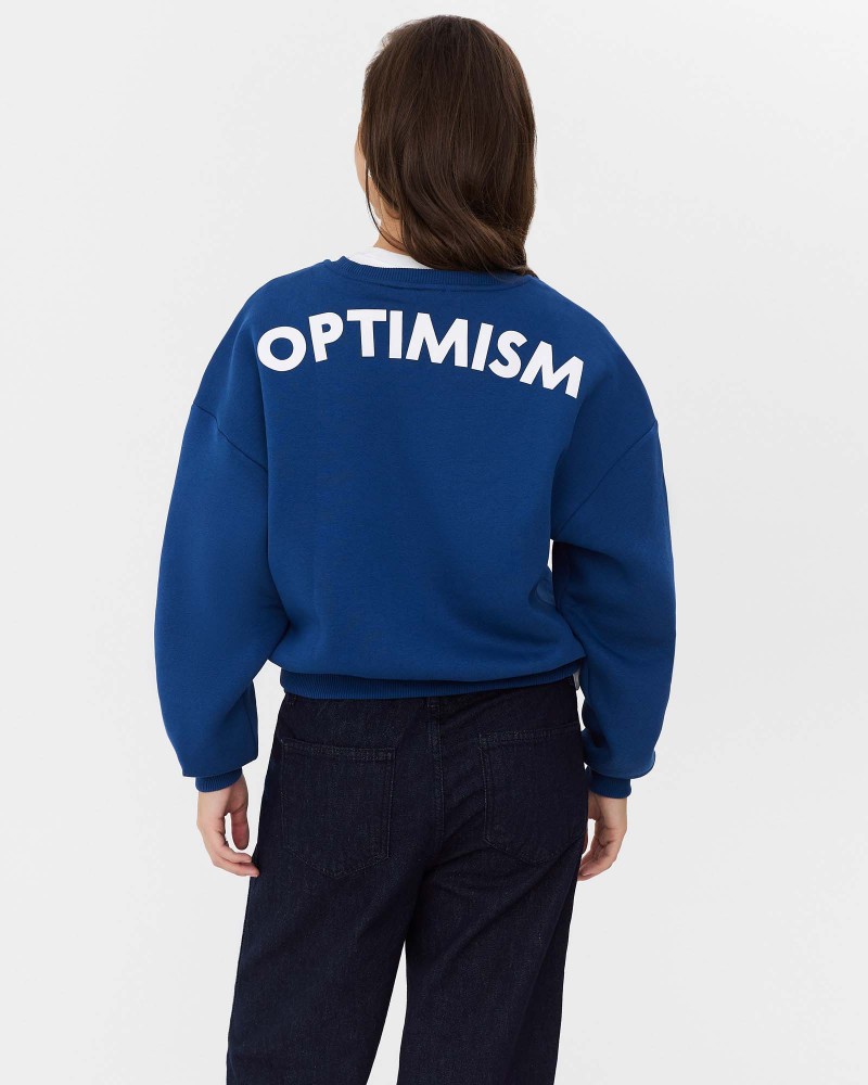 Світшот з написом "Optimism" від FASHIONISTA синій